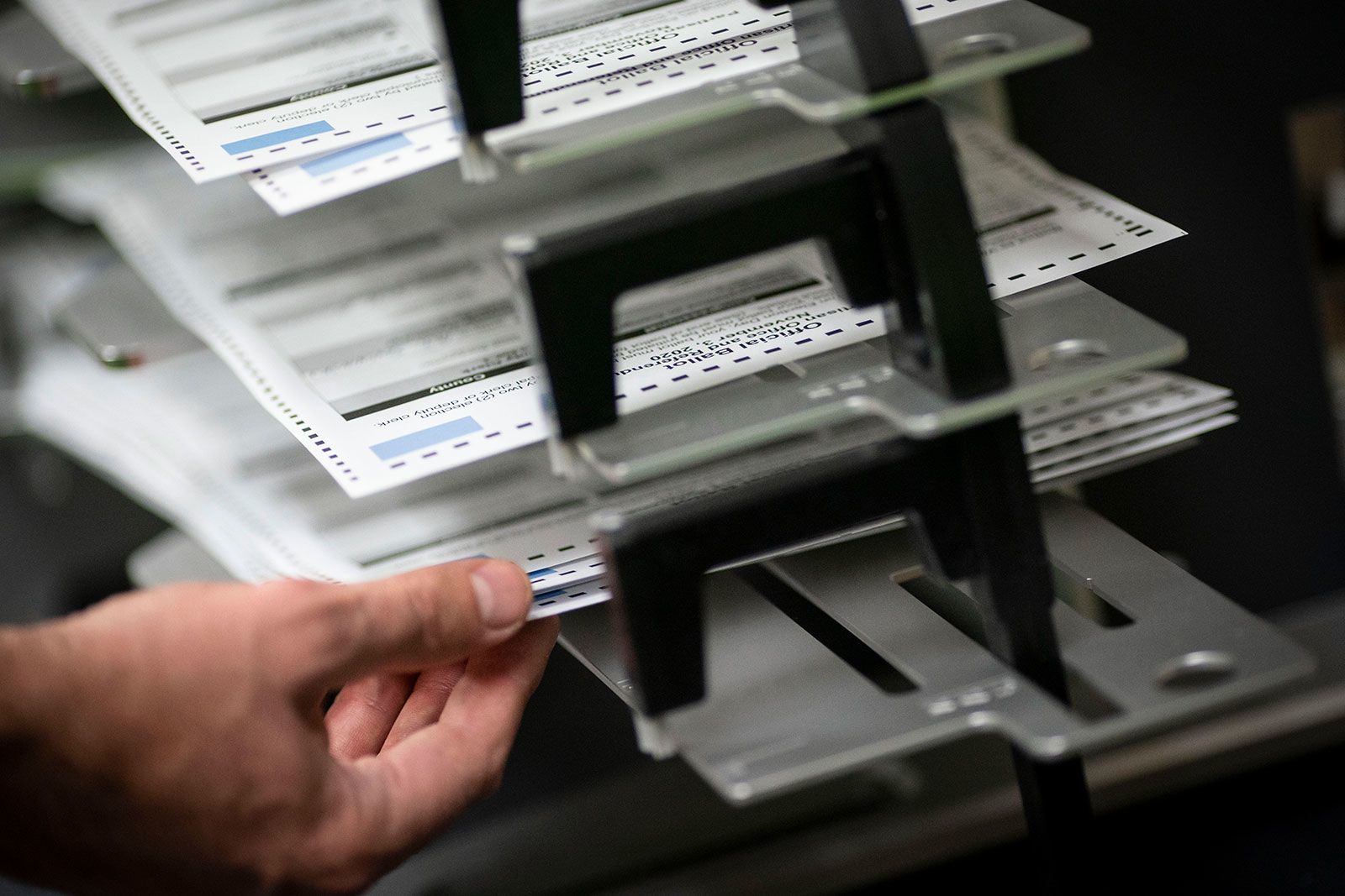 <i>Wong Maye-E/AP/File via CNN Newsource</i><br/>Poll workers sort out early and absentee ballots in Kenosha