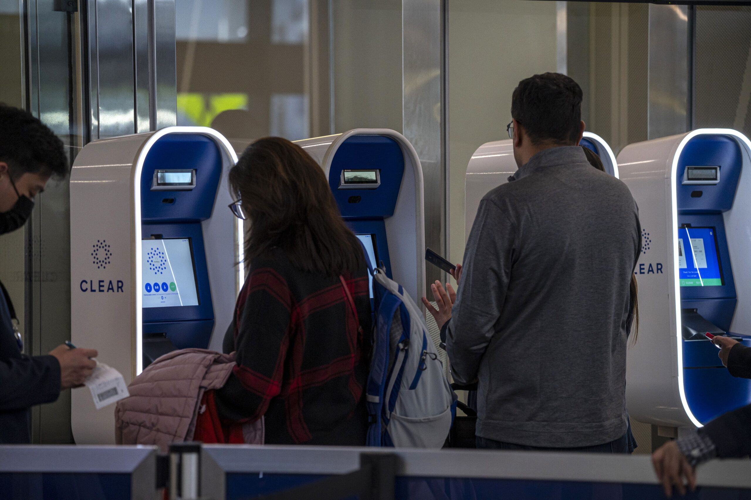 <i>David Paul Morris/Bloomberg/Getty Images via CNN Newsource</i><br/>Travelers use Clear Plus kiosks at San Francisco International Airport in 2023.