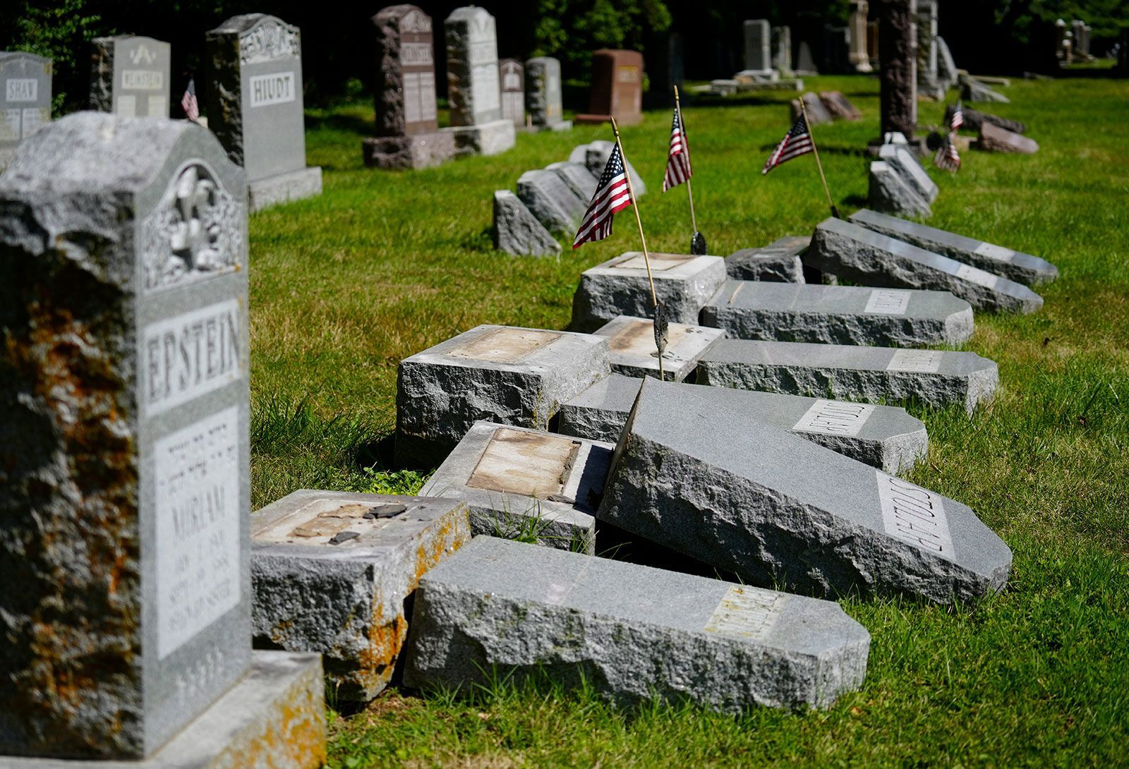 <i>Liz Dufour/The Enquirer/USA Today Network via CNN Newsource</i><br/>Many of the 176 gravestones that were vandalized at the cemeteries had American flags