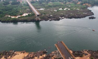 A drone view shows a collapsed bridge between Aguiarnopolis and Estreito