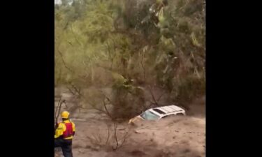 Orange County rescue crews hoist person to safety amid rushing creek waA person trapped in their vehicle in a San Juan Capistrano creek bed amid rushing waters was rescued by swift water rescue teams Thursday morning.