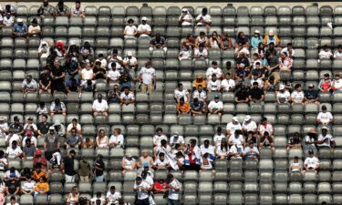 Fans looks on from the stands prior to the match between Real Madrid and Borussia Dortmund. While the game was well-attended