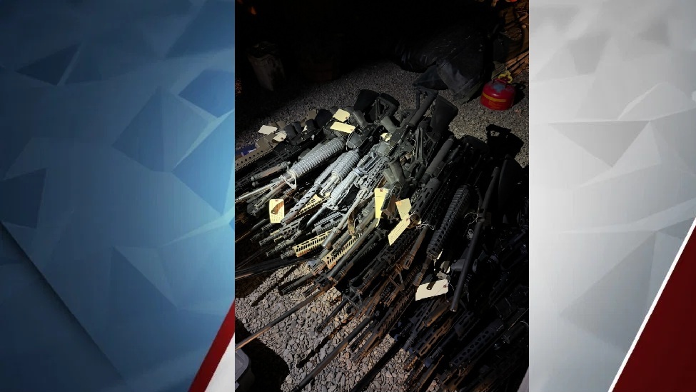 Central Oregon Drug Enforcement Tam displays guns seized in raid.