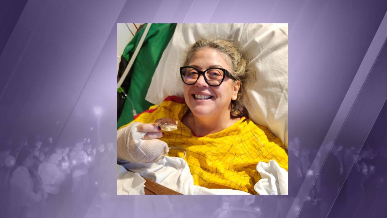 Silver Rail shooting survivor Becky Drury smiles with a treat donut after lengthy surgery this week.
