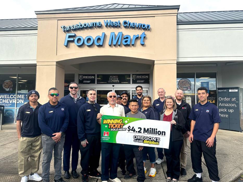 Workers at Tanasbourne West Chevron in Hillsboro celebrate selling a $4.2 million Megabucks ticket.